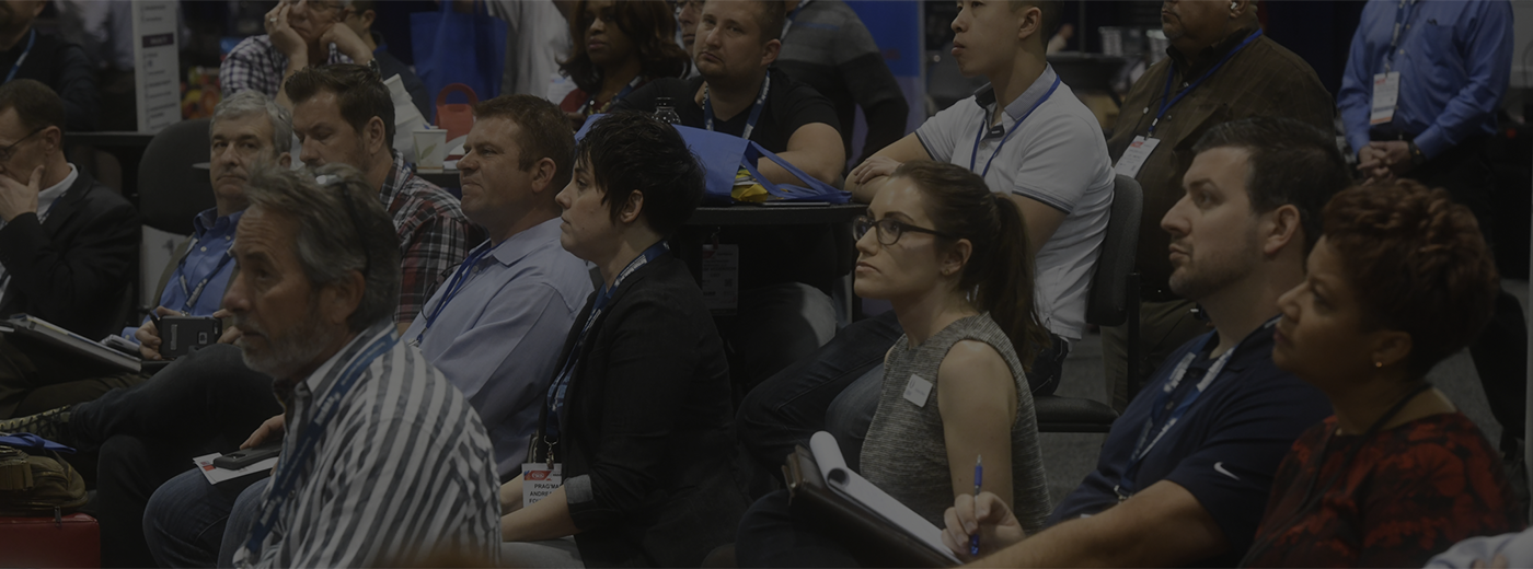 Crowd listening to a conference presentation 