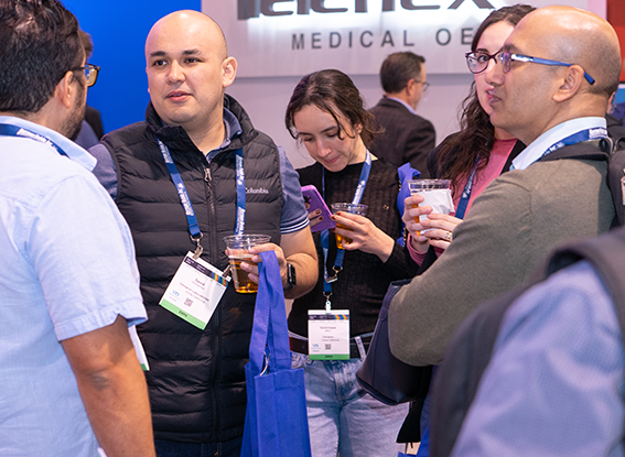 Attendees on the show floor at the Booth Crawl